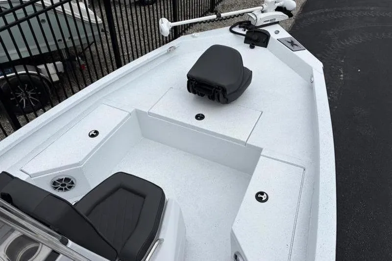 Slide: The Image of 2026 Xpress H20B Bay boat interior with seating and storage compartments. - 6