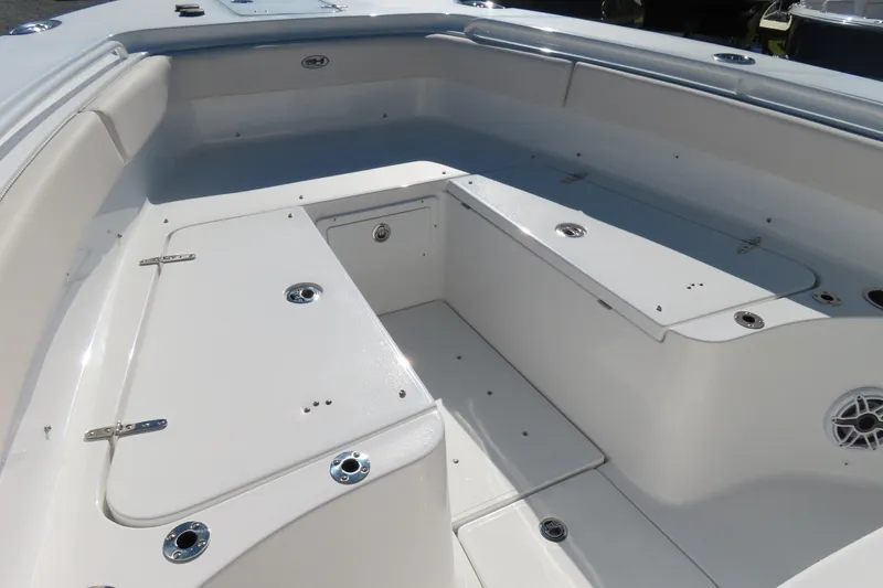 Slide: The Image of 2025 Sea Hunt Gamefish 27 Forward Seating, spacious white deck with storage compartments. - 11