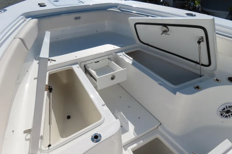 Slide: The Image of 2025 Sea Hunt Gamefish 27 Forward Seating boat storage compartments and seating area. - 12