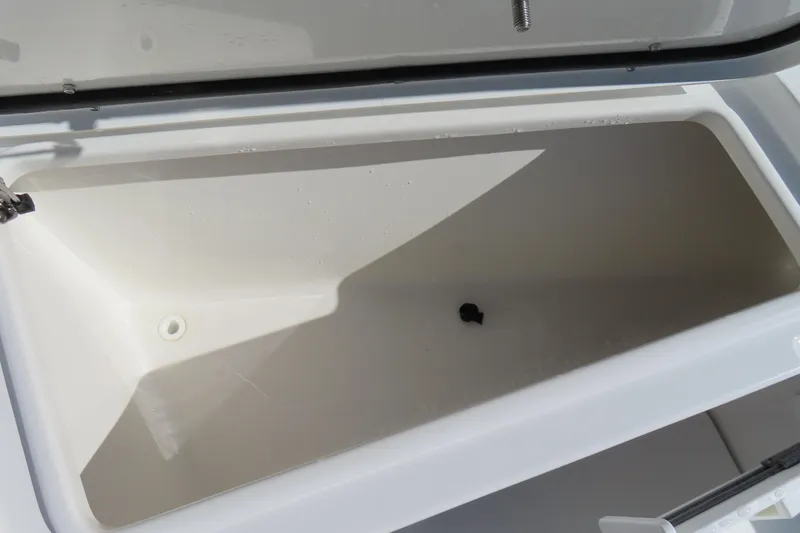 Slide: The Image of Open storage compartment on 2025 Sea Hunt Gamefish 27 Forward Seating boat. - 14