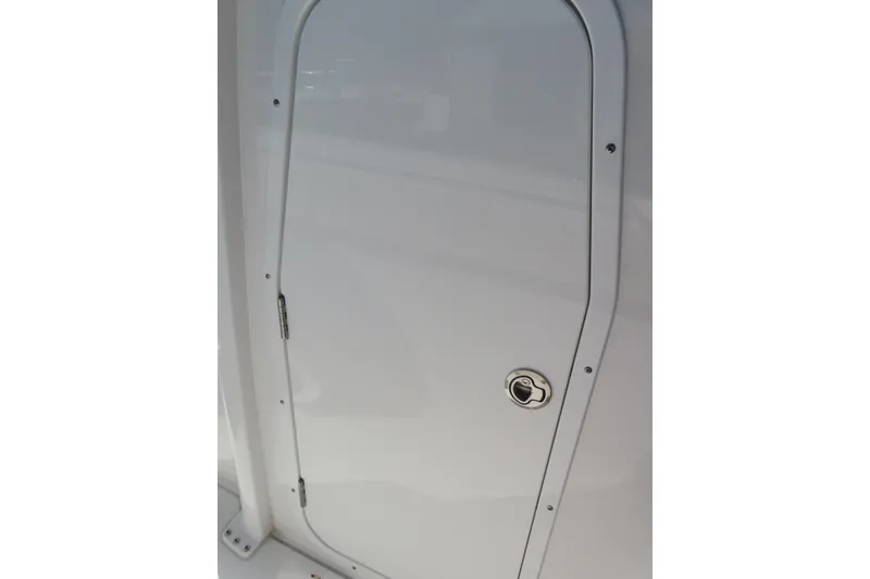 Slide: The Image of White door on 2025 Sea Hunt Gamefish 27 Forward Seating boat. - 22