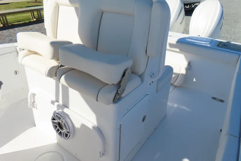 Slide: The Image of 2025 Sea Hunt Gamefish 27 Forward Seating boat interior with white cushioned seats. - 24
