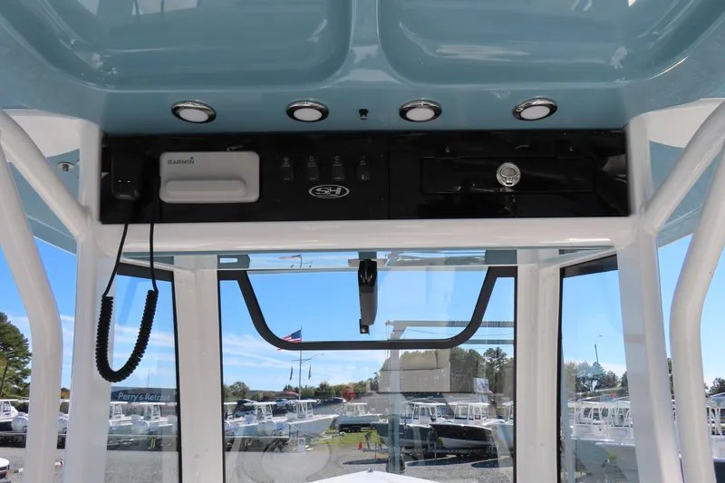Slide: The Image of 2025 Sea Hunt Gamefish 27 Forward Seating helm with Garmin electronics and overhead lighting. - 33