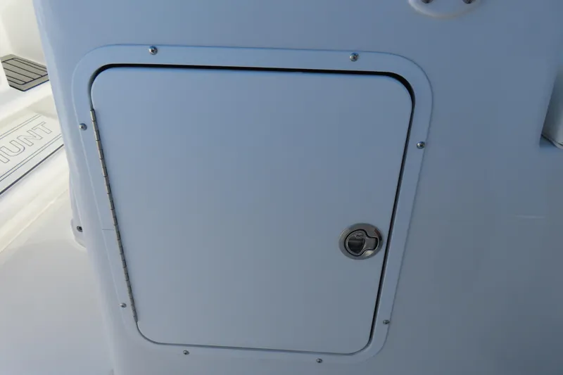 Slide: The Image of 2025 Sea Hunt Gamefish 27 Forward Seating storage compartment with secure latch. - 34