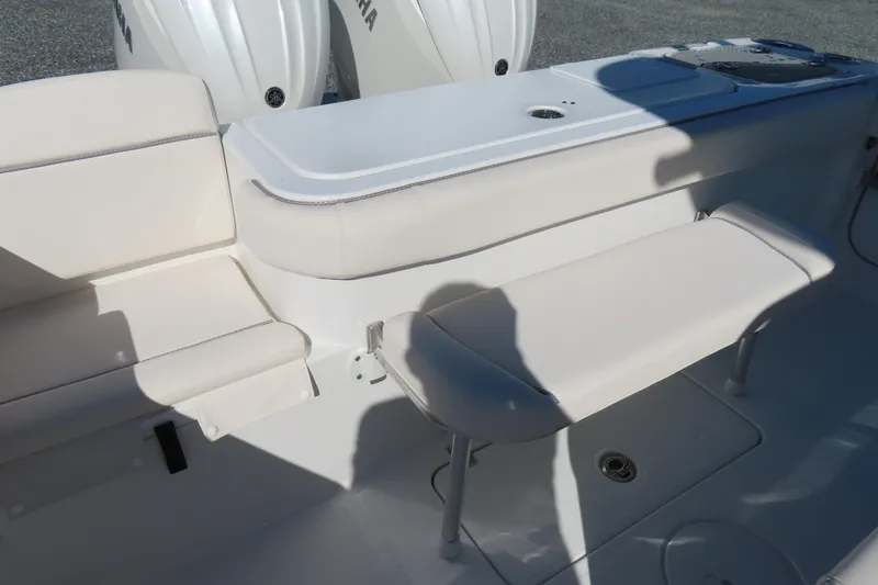 Slide: The Image of 2025 Sea Hunt Gamefish 27 Forward Seating interior with cushioned bench and dual engines. - 43