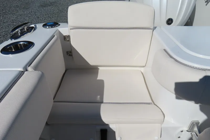 Slide: The Image of 2025 Sea Hunt Gamefish 27 Forward Seating with white cushioned seats and cup holders. - 44