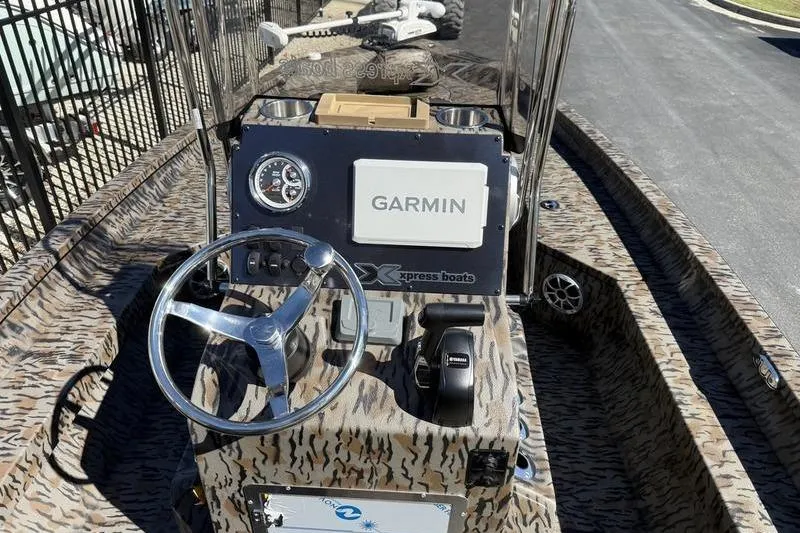 Slide: The Image of 2026 Xpress H20B Bay boat dashboard with Garmin navigation system. - 11