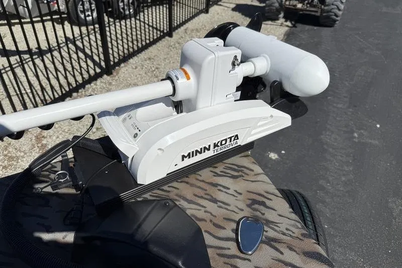 Slide: The Image of Minn Kota Terrova motor on 2026 Xpress H20B Bay boat, camo pattern deck. - 15