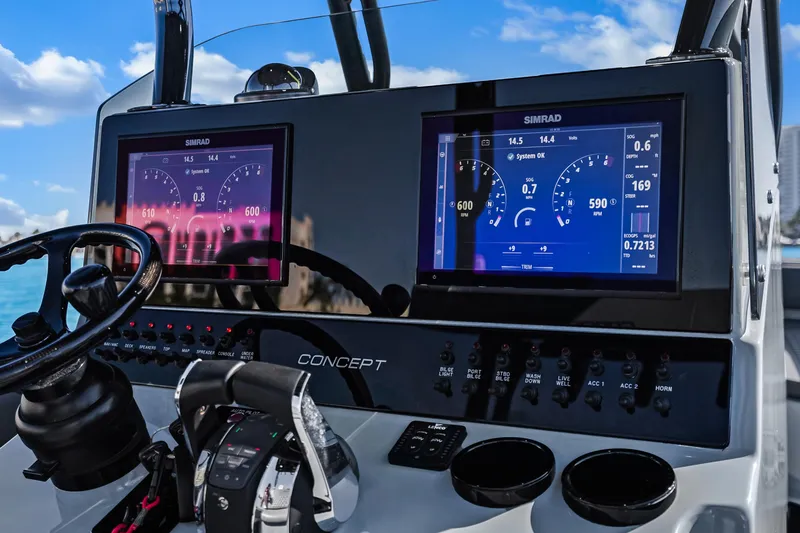Slide: The Image of Control panel with dual Simrad displays. - 14