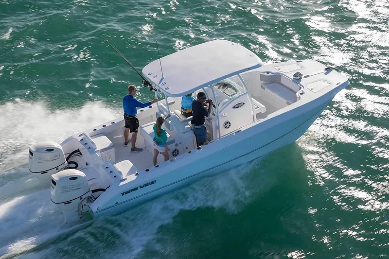 Slide: The Image of Manufacturer Provided Image: 2021 Twin Vee 260 VIVA boat cruising on the water with passengers. - 10