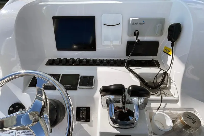 Slide: The Image of 2021 Twin Vee 260 VIVA boat dashboard with Garmin navigation and control systems. - 3