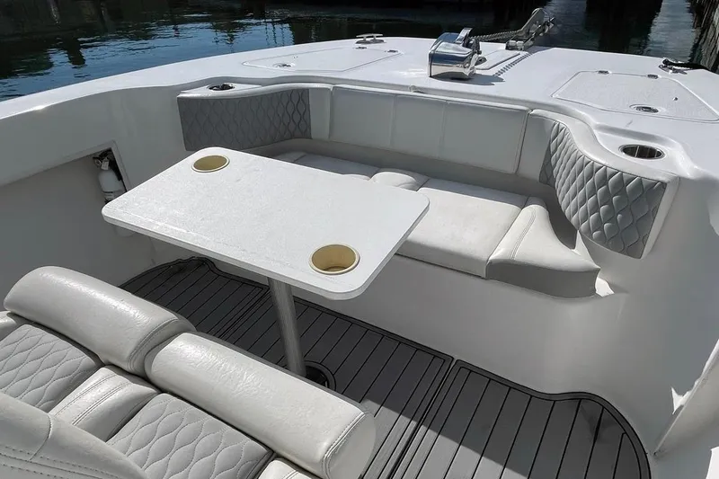 Slide: The Image of 2021 Twin Vee 260 VIVA boat interior with cushioned seating and table. - 5