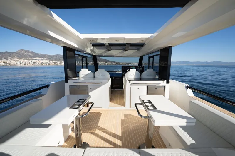 Slide: The Image of Luxurious 2026 De Antonio Yachts 50 Coupe interior with sleek design and ocean view. - 9