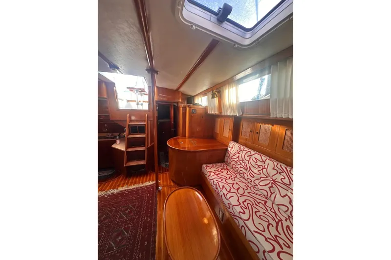 Slide: The Image of 1983 Camper & Nicholsons Cutter Rig interior with wood finish and patterned seating. - 15