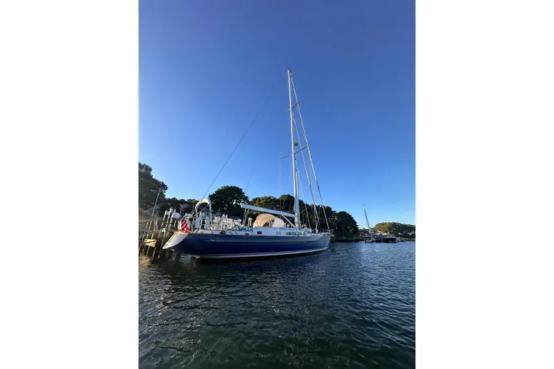 Slide: The Image of 1983 Camper & Nicholsons Cutter Rig sailboat docked on a sunny day. - 2