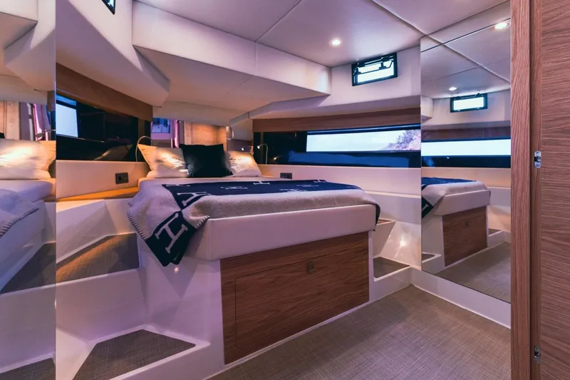 Slide: The Image of Luxurious interior cabin of 2026 De Antonio Yachts 50 Open, featuring modern design and cozy bedding. - 16