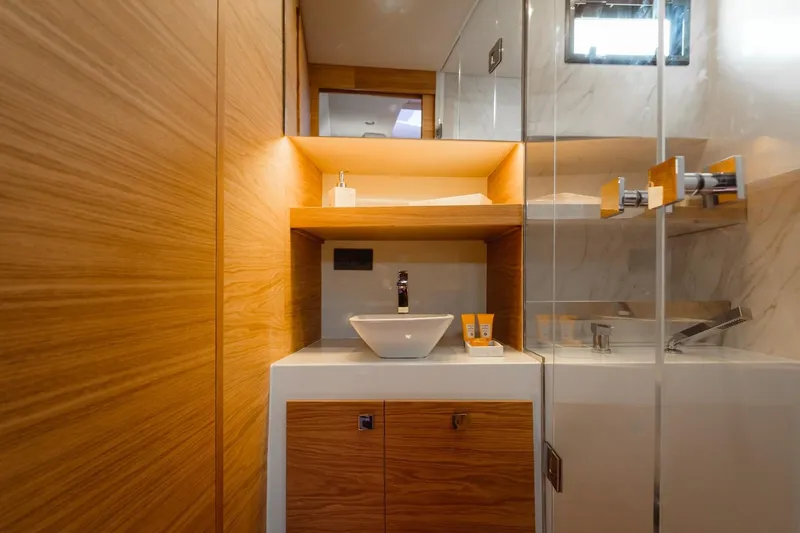 Slide: The Image of Luxurious bathroom interior of 2026 De Antonio Yachts 50 Open, featuring modern wood and marble design. - 21