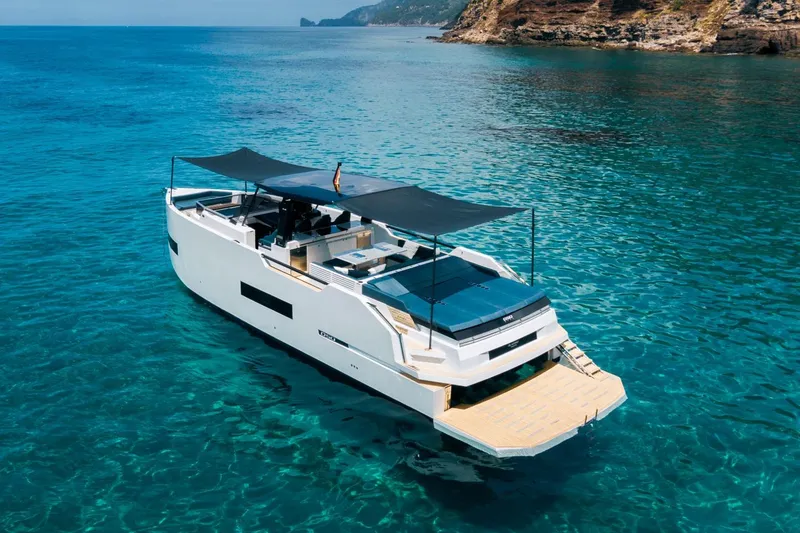 Slide: The Image of 2026 De Antonio Yachts 50 Open on clear blue water, featuring sleek design and spacious deck. - 7