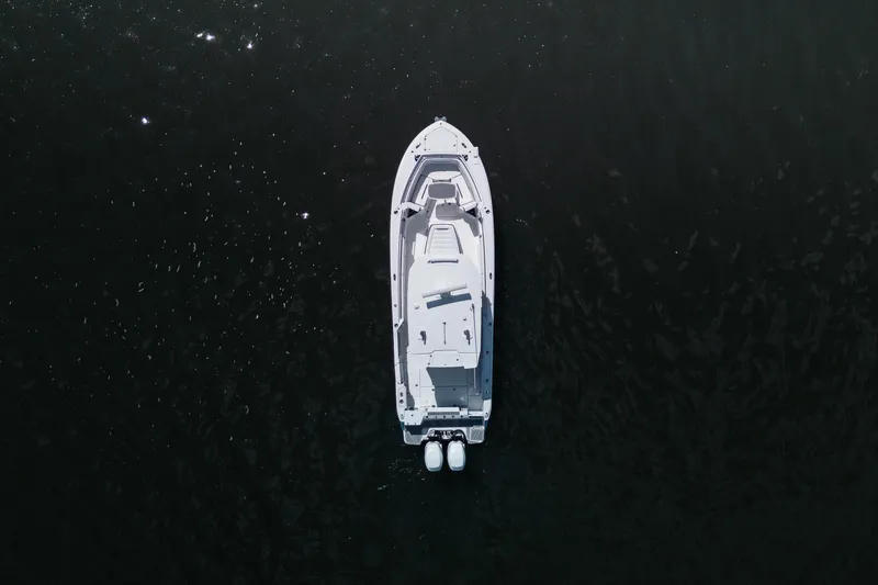Slide: The Image of Aerial view of 2021 Blackfin 332 CC boat on dark water. - 102
