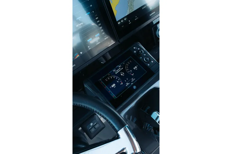 Slide: The Image of 2021 Blackfin 332 CC dashboard with advanced navigation and control displays. - 11