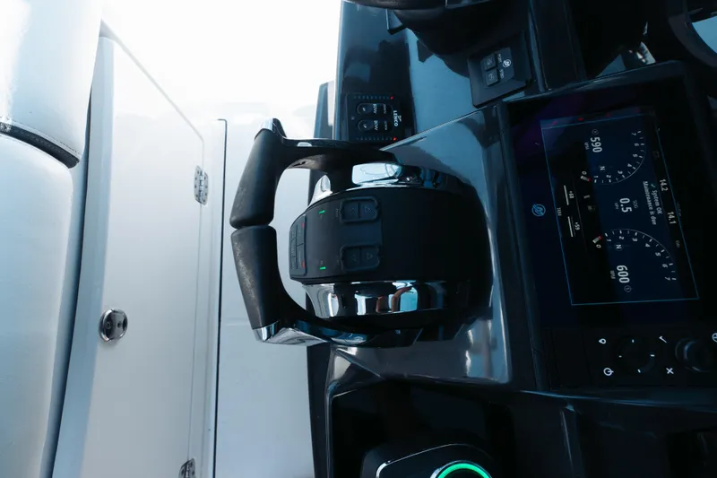 Slide: The Image of Control panel of 2021 Blackfin 332 CC boat with throttle and digital display. - 16