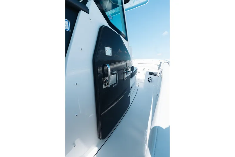 Slide: The Image of 2021 Blackfin 332 CC boat side view with sleek design and modern features. - 19