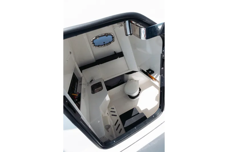 Slide: The Image of Interior of 2021 Blackfin 332 CC boat cabin with sink and toilet. - 21