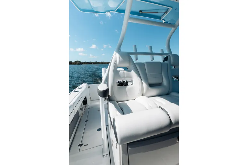 Slide: The Image of 2021 Blackfin 332 CC boat interior with white seating and ocean view. - 27