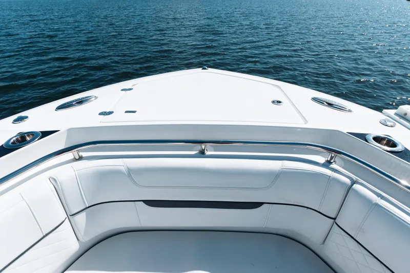 Slide: The Image of Bow view of 2021 Blackfin 332 CC boat on calm water. - 3