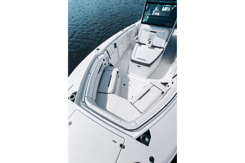 Slide: The Image of 2021 Blackfin 332 CC boat with spacious seating and sleek design on the water. - 32