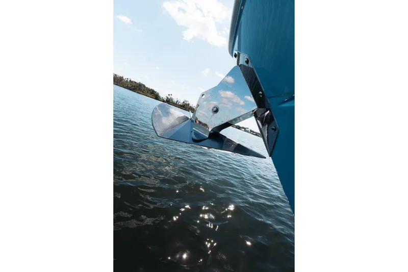 Slide: The Image of 2021 Blackfin 332 CC boat anchor over water, reflecting sunlight. - 33