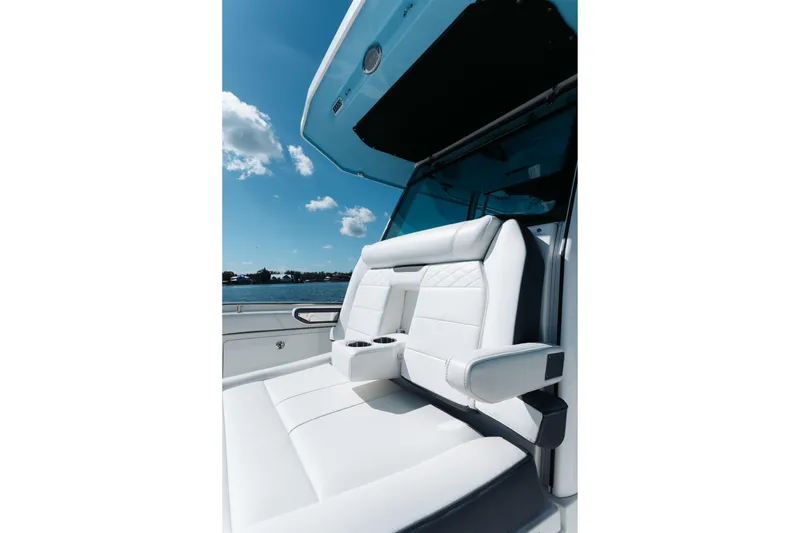 Slide: The Image of Luxurious seating on 2021 Blackfin 332 CC boat under clear blue sky. - 4