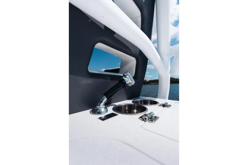 Slide: The Image of 2021 Blackfin 332 CC boat detail with cup holders and water view. - 43