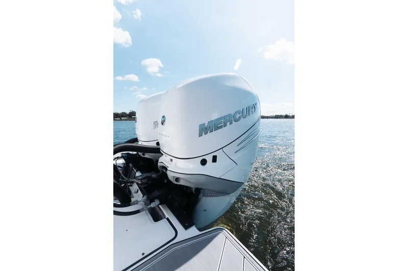 Slide: The Image of 2021 Blackfin 332 CC boat with Mercury outboard engine on water. - 47