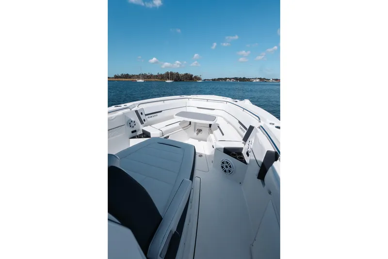 Slide: The Image of 2021 Blackfin 332 CC boat interior with seating, on a sunny day at sea. - 52