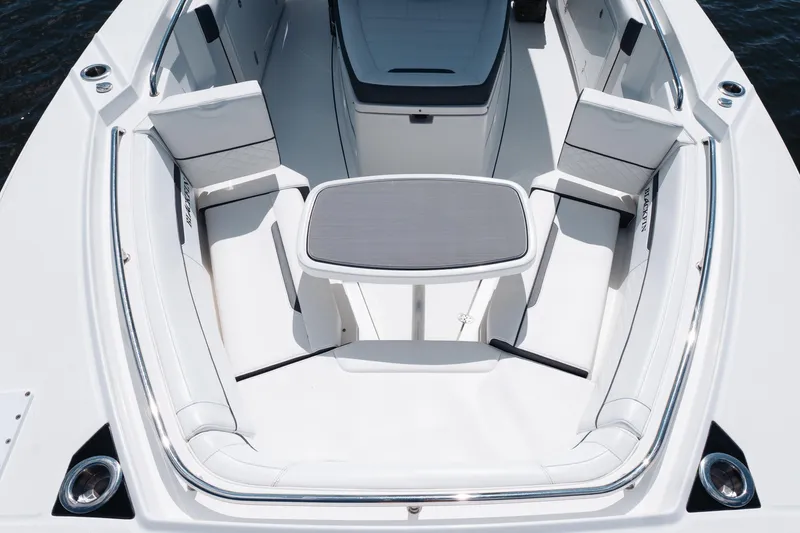 Slide: The Image of 2021 Blackfin 332 CC boat interior with seating and table, showcasing luxury design. - 57