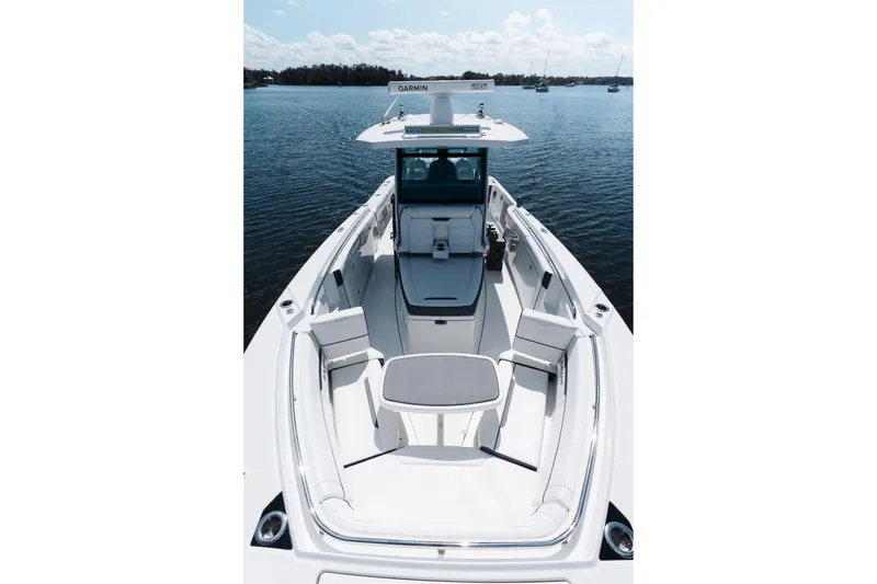 Slide: The Image of 2021 Blackfin 332 CC boat with spacious seating on calm water. - 58