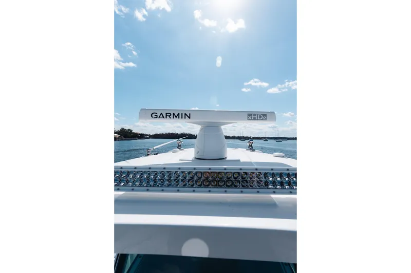 Slide: The Image of 2021 Blackfin 332 CC boat with Garmin xHD2 radar on a sunny day. - 61