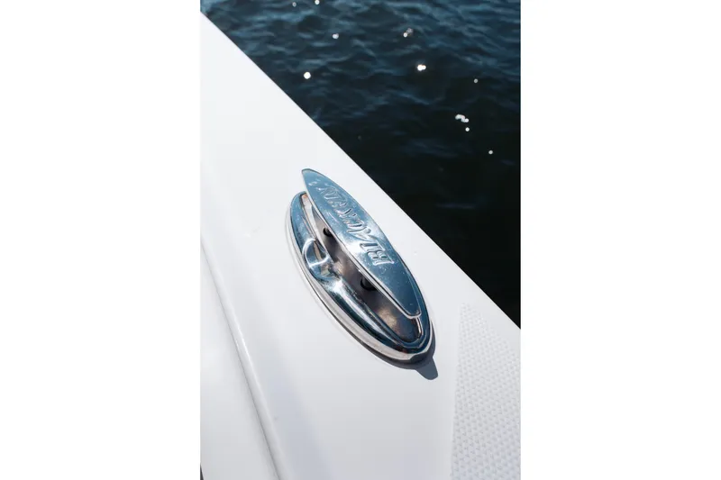 Slide: The Image of 2021 Blackfin 332 CC boat cleat detail against water background. - 64