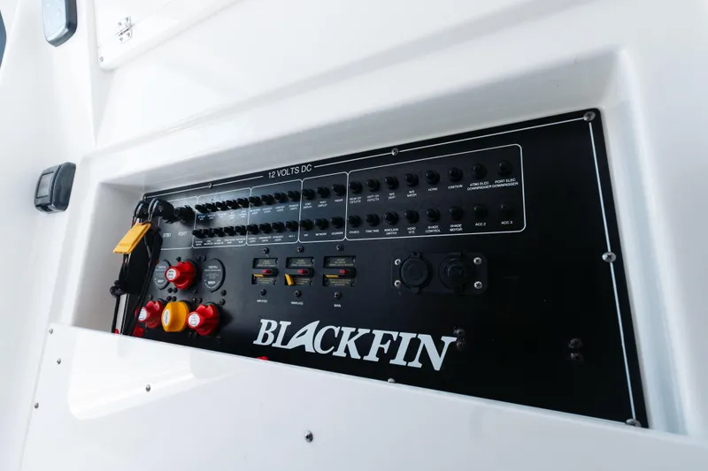 Slide: The Image of Control panel of 2021 Blackfin 332 CC boat, featuring switches and dials. - 67