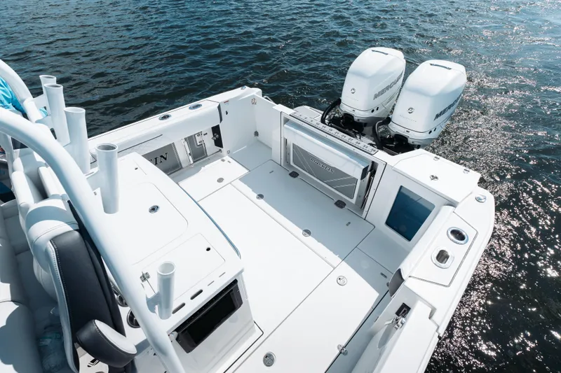 Slide: The Image of 2021 Blackfin 332 CC boat with dual Mercury engines on open water. - 70