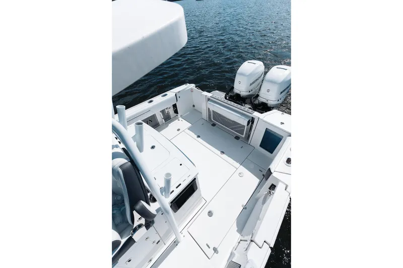 Slide: The Image of 2021 Blackfin 332 CC boat with dual engines on open water. - 71