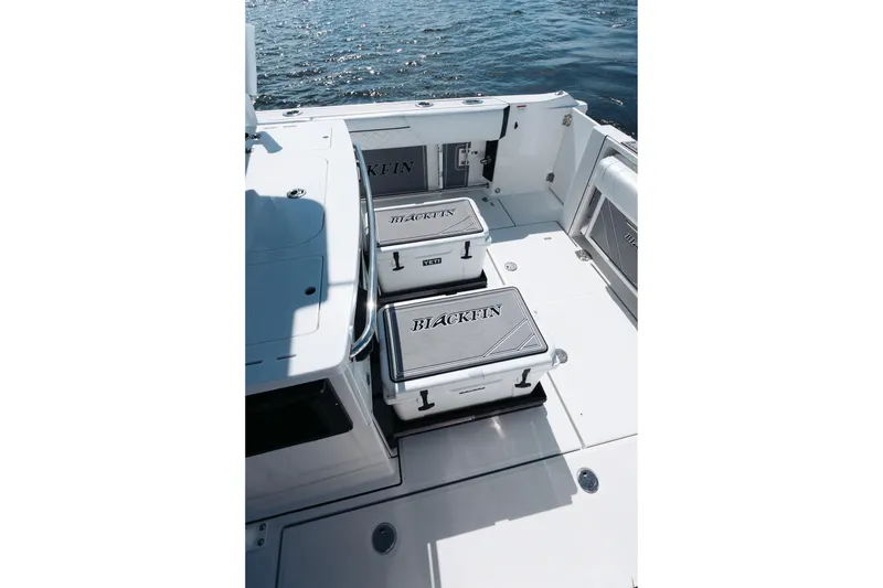 Slide: The Image of 2021 Blackfin 332 CC boat deck with storage compartments and ocean view. - 72