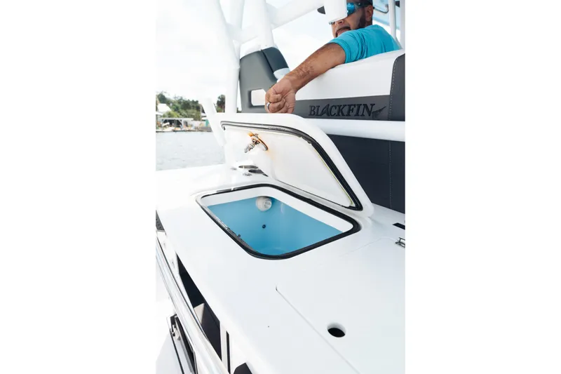 Slide: The Image of 2021 Blackfin 332 CC boat with open storage compartment, featuring sleek design and modern amenities. - 91