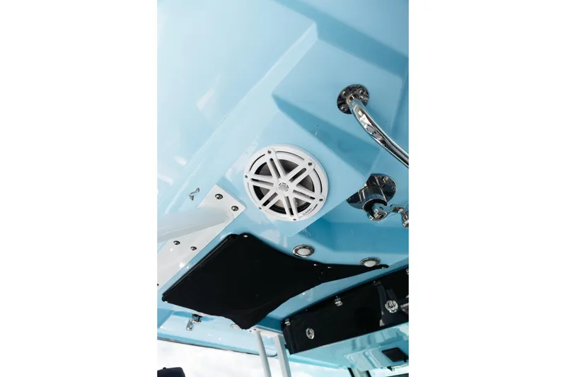 Slide: The Image of 2021 Blackfin 332 CC boat interior with speaker and chrome fixtures. - 99