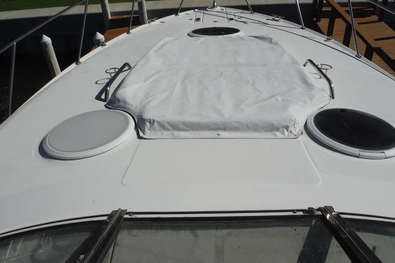 Slide: The Image of 2008 Regal Commodore 3760 IO boat deck with hatches and cover. - 14