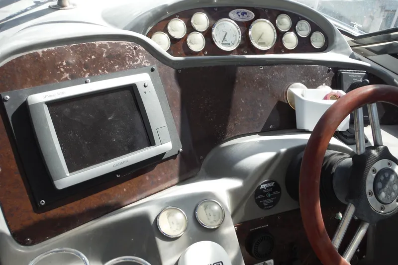 Slide: The Image of 2008 Regal Commodore 3760 IO dashboard with Garmin GPS and classic gauges. - 15