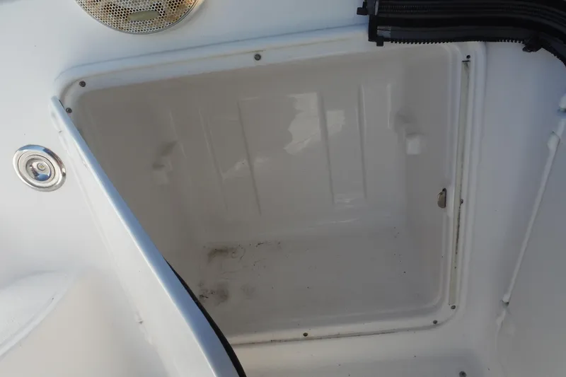 Slide: The Image of Open storage compartment on 2008 Regal Commodore 3760 IO boat. - 19