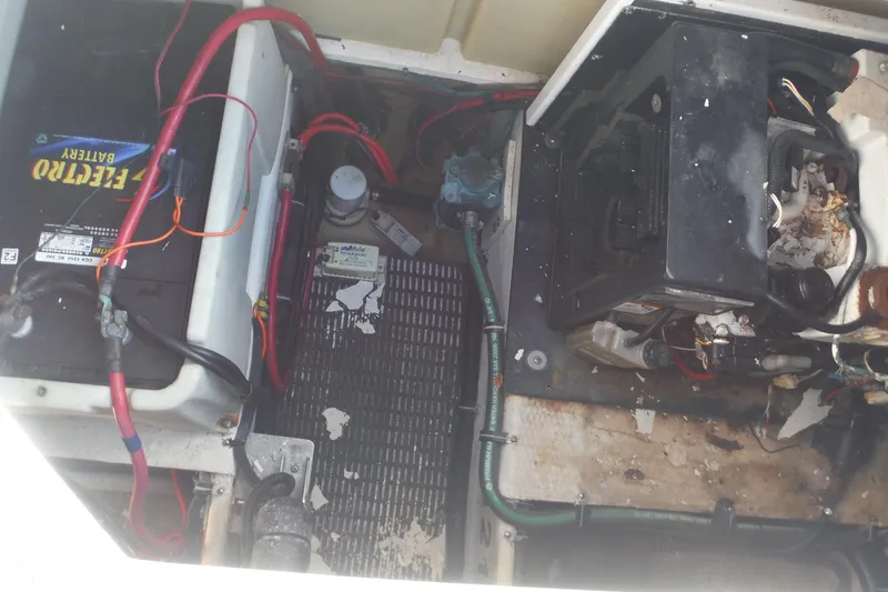 Slide: The Image of Engine compartment of 2008 Regal Commodore 3760 IO with battery and wiring visible. - 20