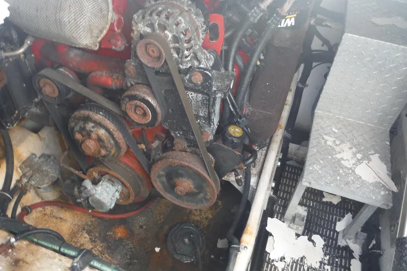 Slide: The Image of 2008 Regal Commodore 3760 IO engine compartment with visible belts and pulleys. - 21